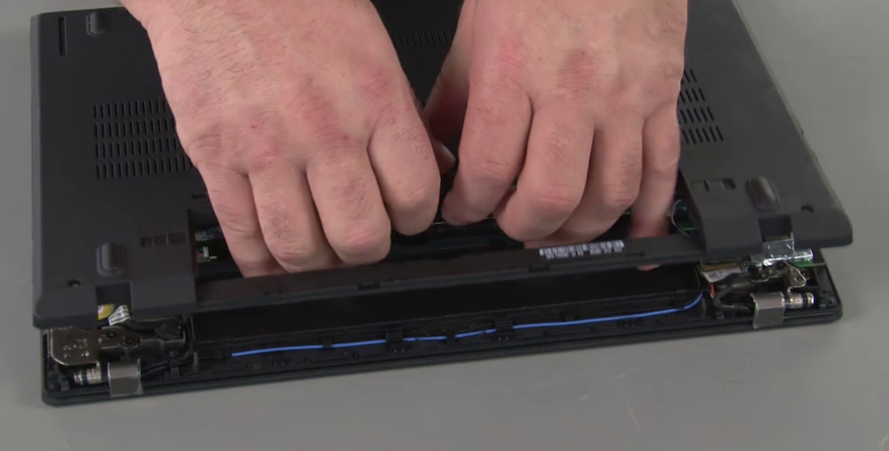 Lift from center in battery bay to remove T480 base cover